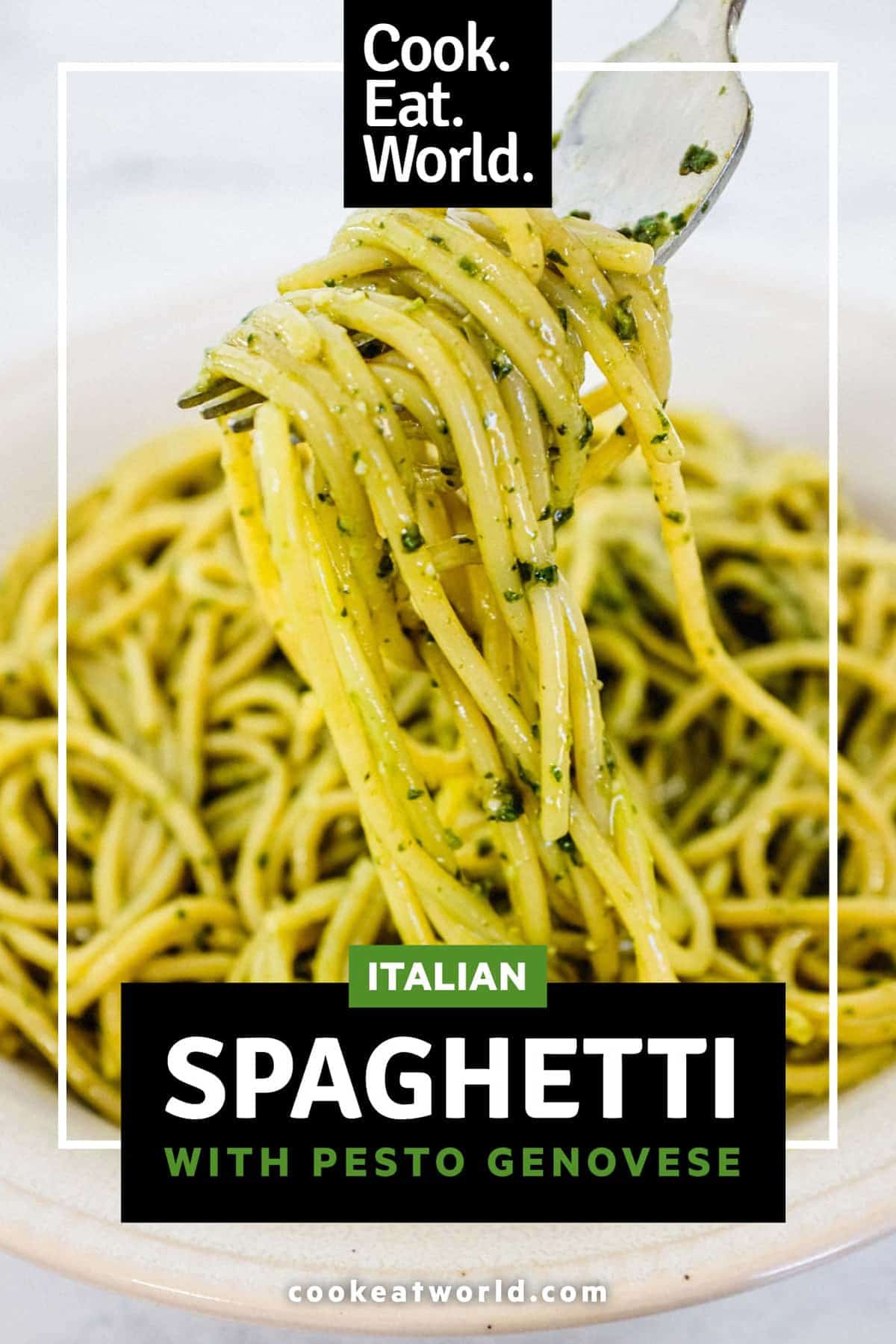 A bowl of Spaghetti with Pesto Genovese. A fork twists around a few noodles.