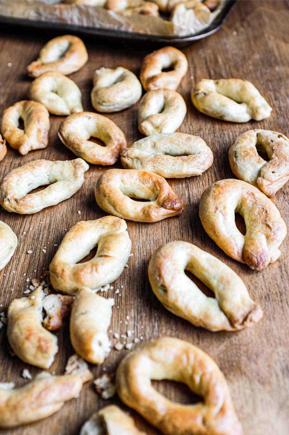 Taralli Pugliesi (bread snacks from Italy) scattered on a wooden table