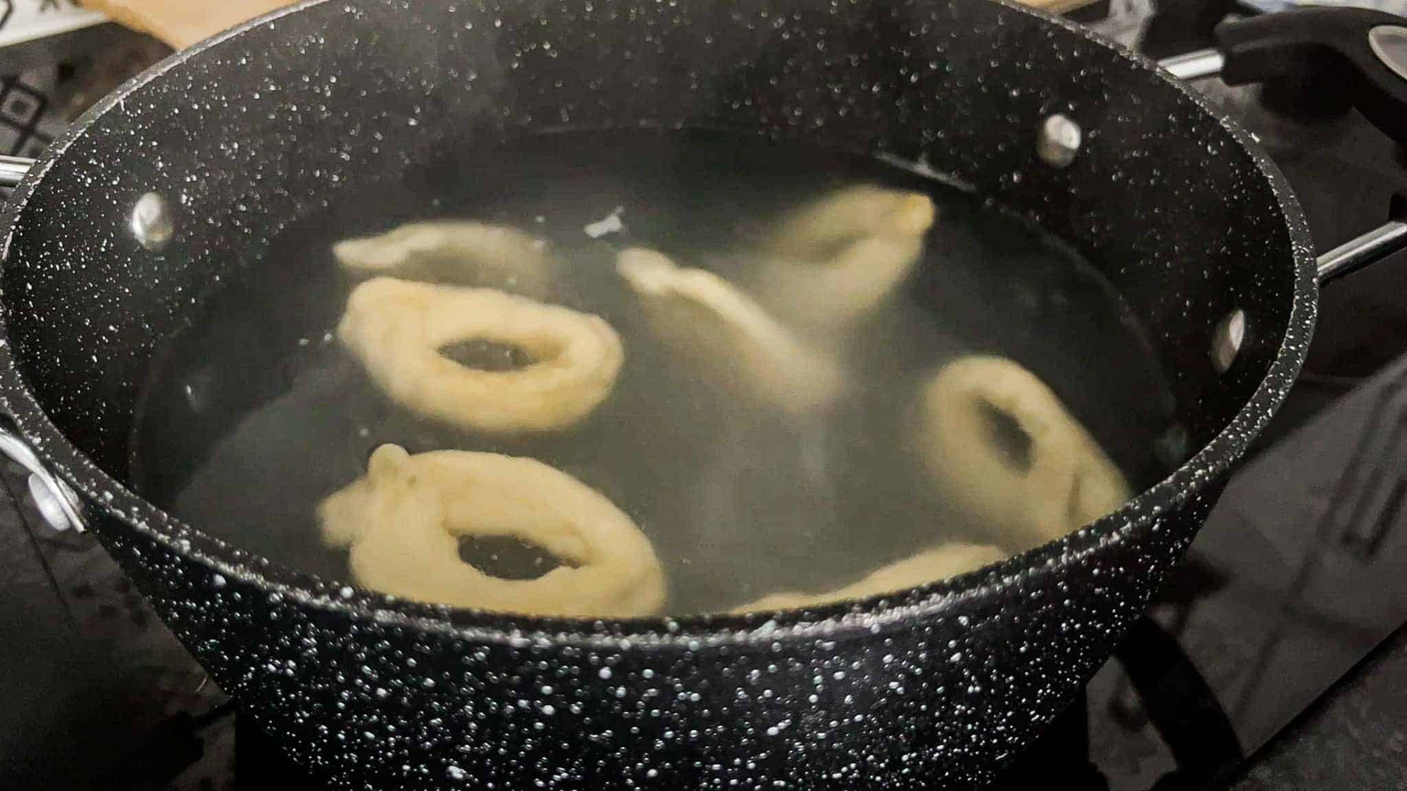 Taralli Pugliesi boiling in water until they float to the surface