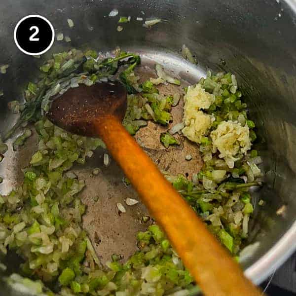 Italian Sausage and Lentils | cookeatworld.com Onions and celery being sautéed in a pan with a little garlic and fresh herbs.