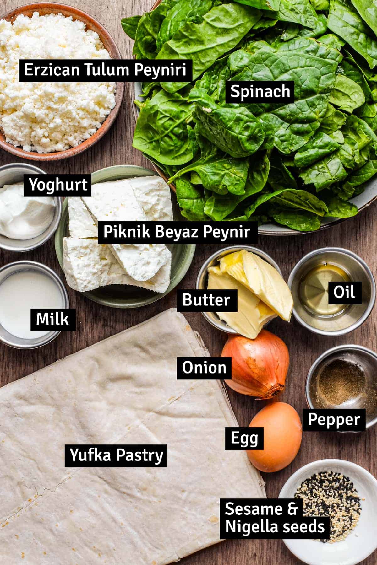The ingredients for a Turkish cheese börek pie with cheese and spinach: two types of Turkish cheese, yufka pastry, spinach and more.