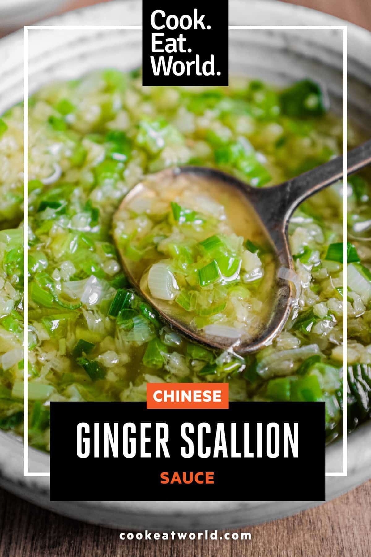 A small bowl of Chinese Ginger Scallion Sauce with a small serving spoon