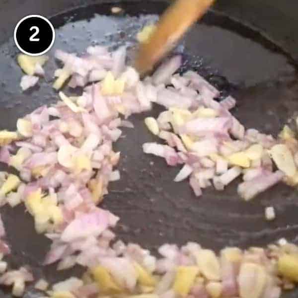 Onions and garlic frying in a pan
