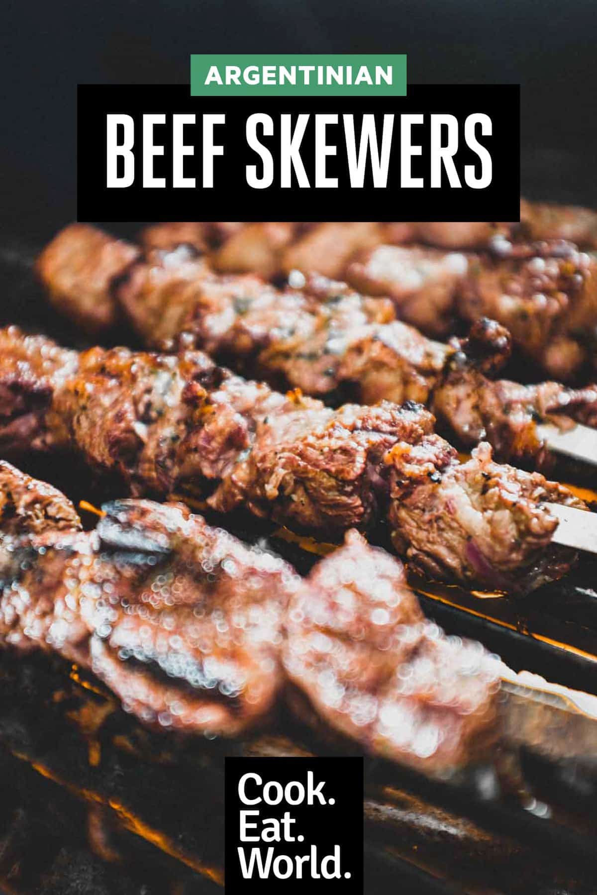 Argentinian beef skewers on metal skewers on a hot bbq grill