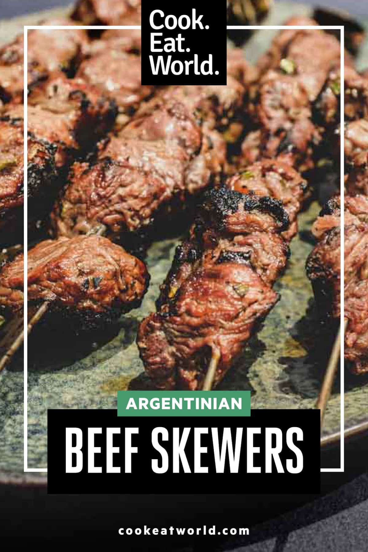 Argentinian beef skewers on metal skewers on a platter