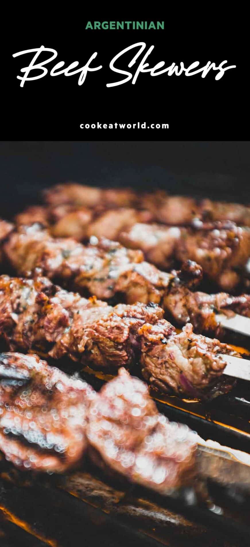 Argentinian beef skewers on metal skewers on a hot bbq grill