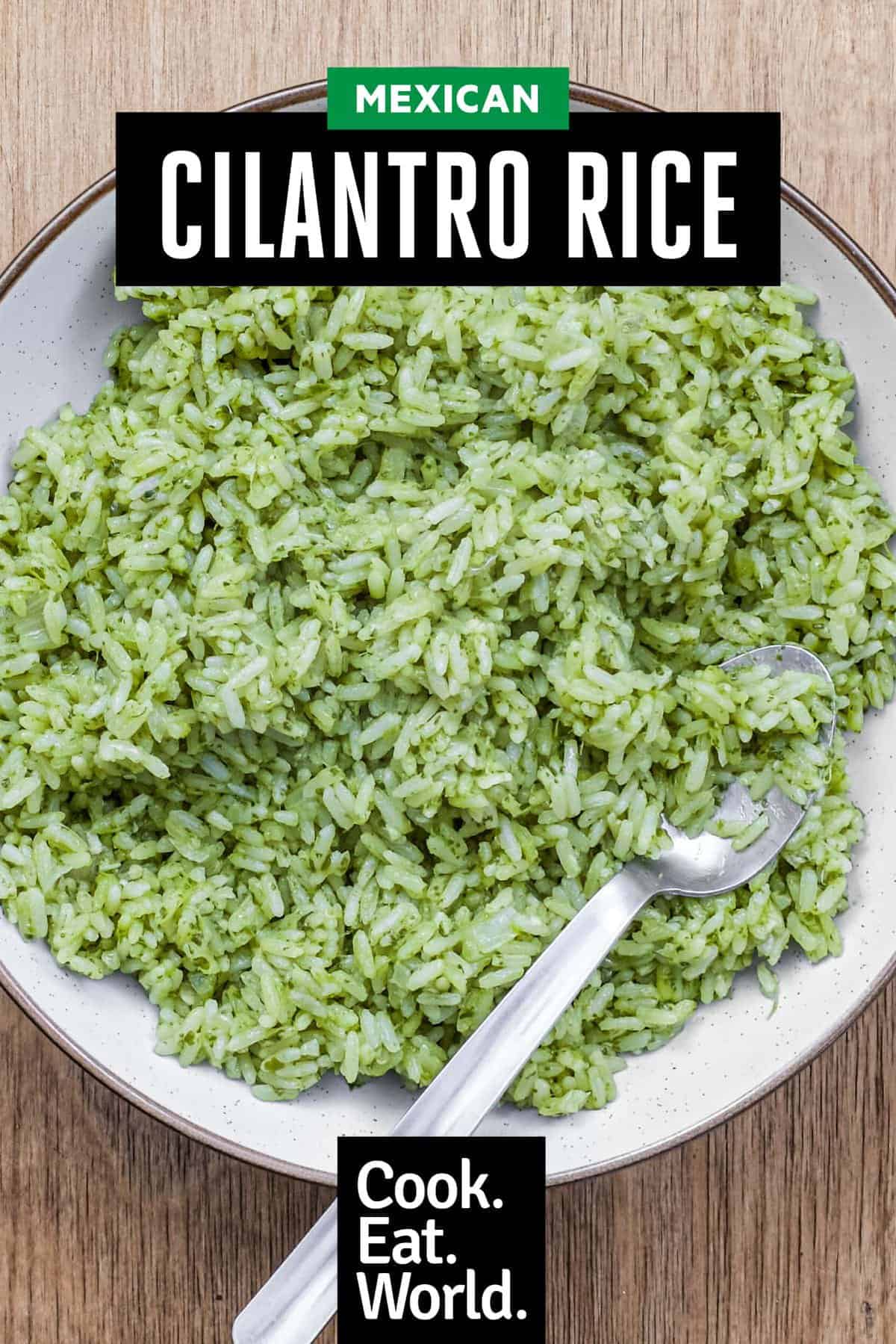 A bowl of Mexican Cilantro Rice (Green Rice) with a spoon.