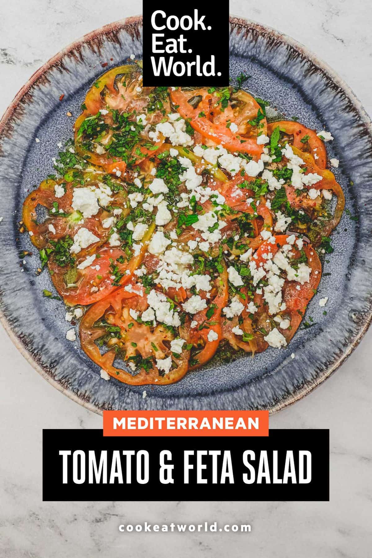 Tomatoes dressed in vinegar and oil with feta cheese and chopped mint