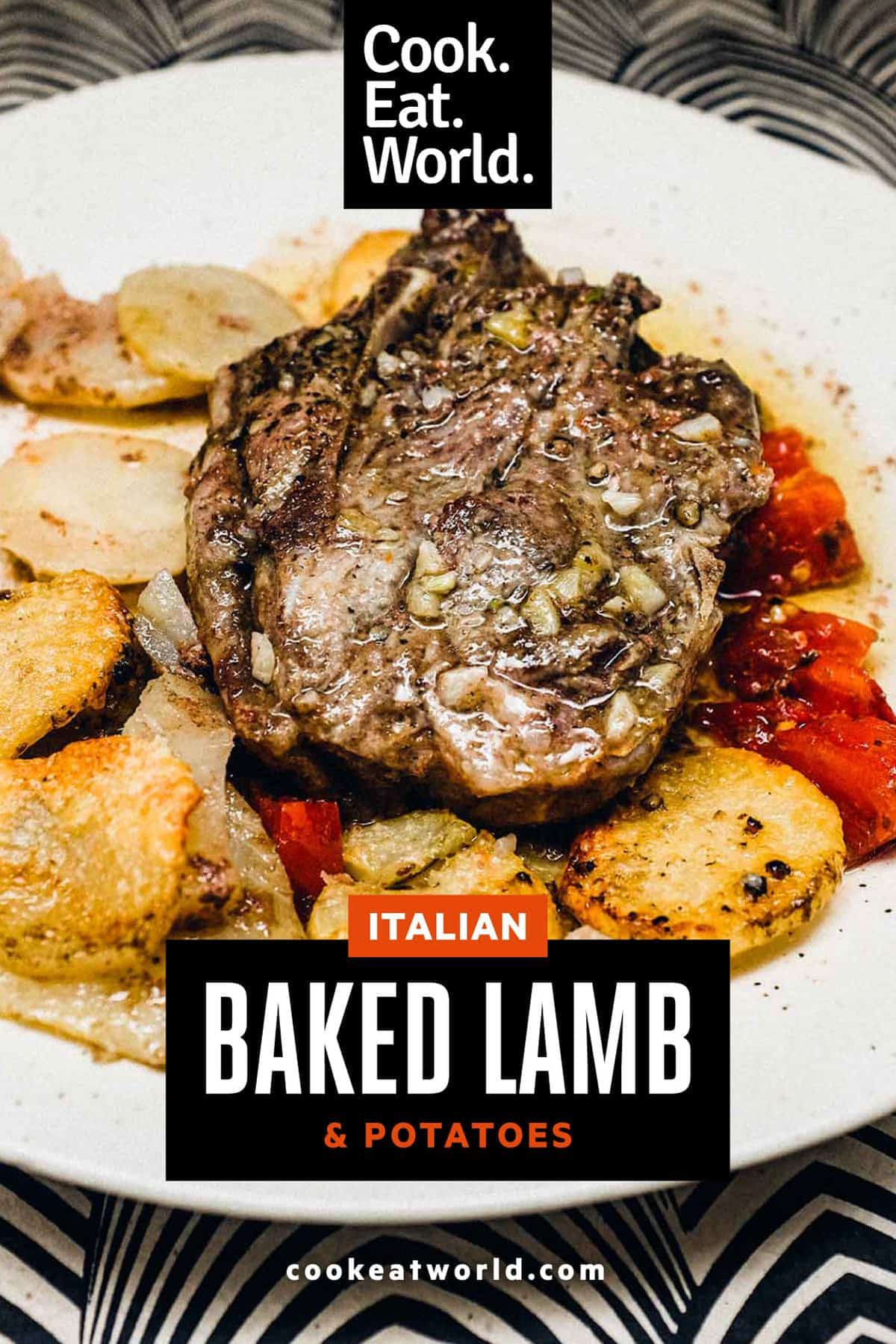 A plate of baked lamb with potatoes and tomatoes