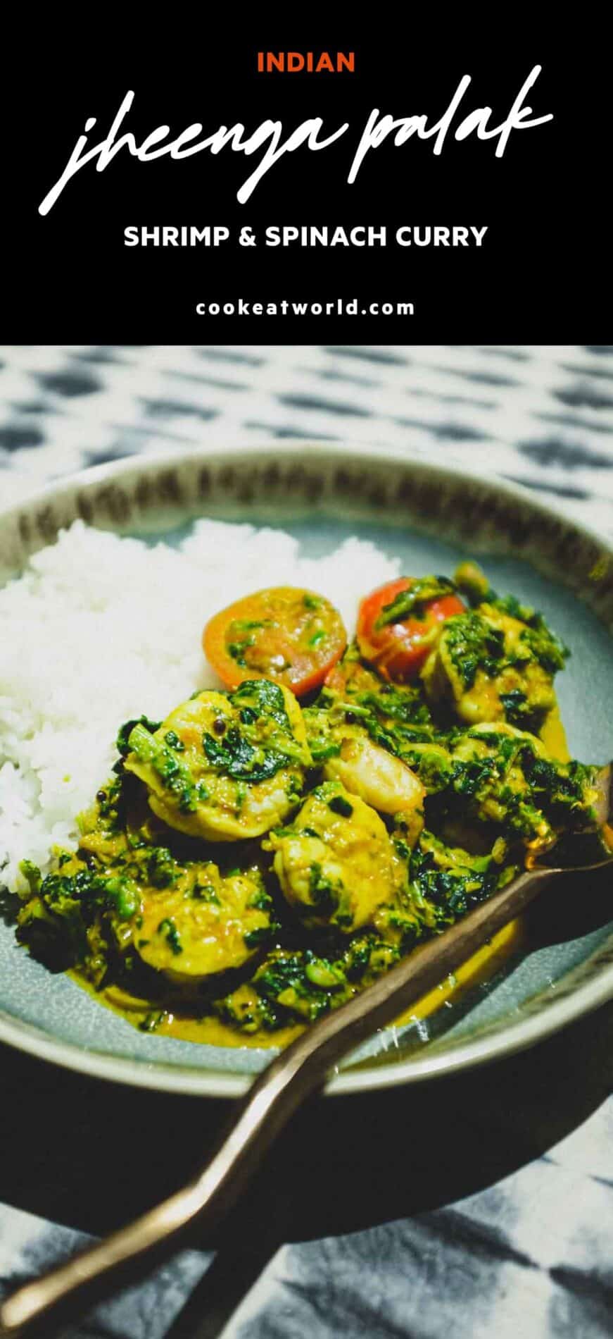 A small bowl of shrimp curry and rice with a fork and spoon