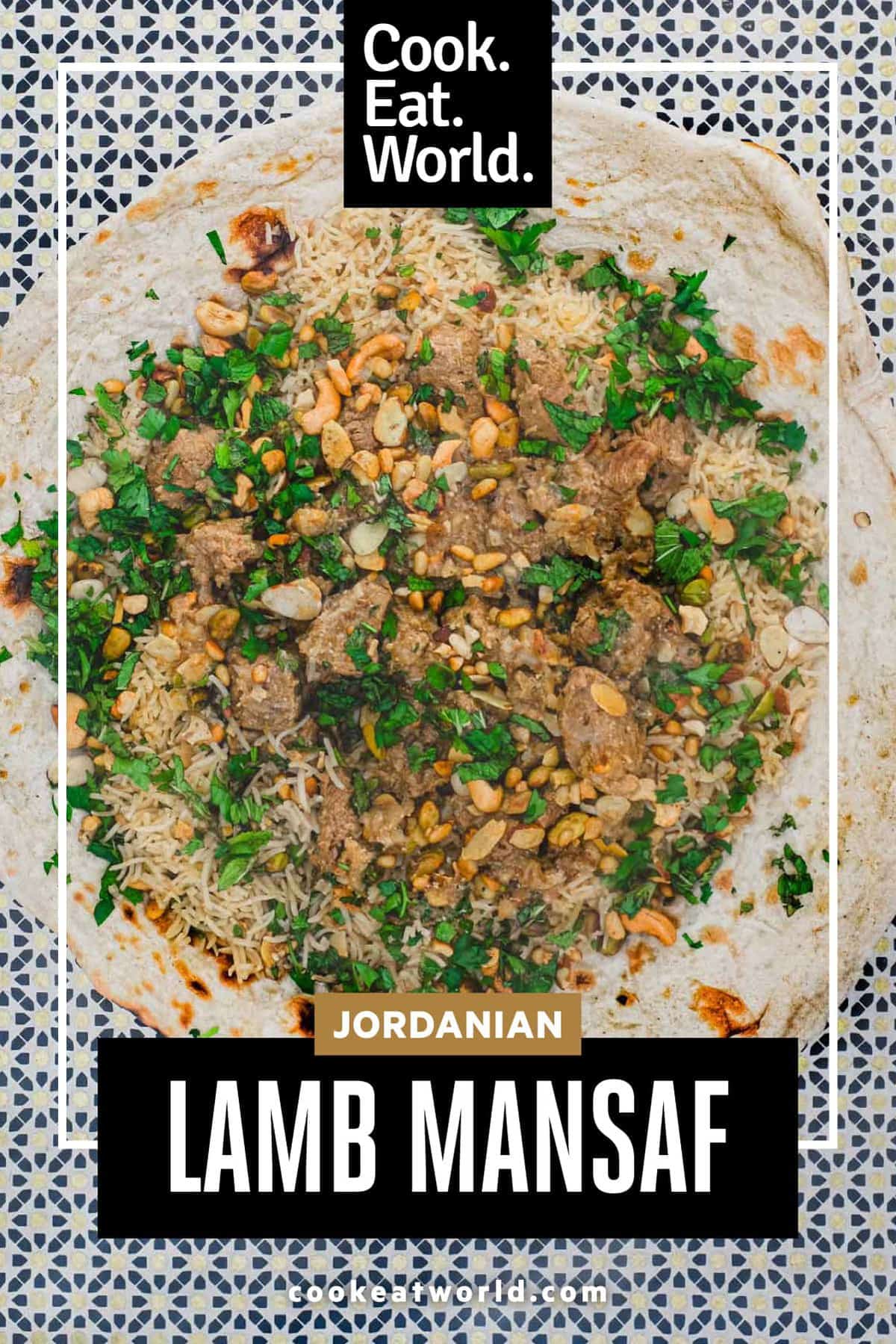 Jordanian lamb Mansaf stew sits on a giant flatbread. It's garnished with fresh herbs and toasted nuts.