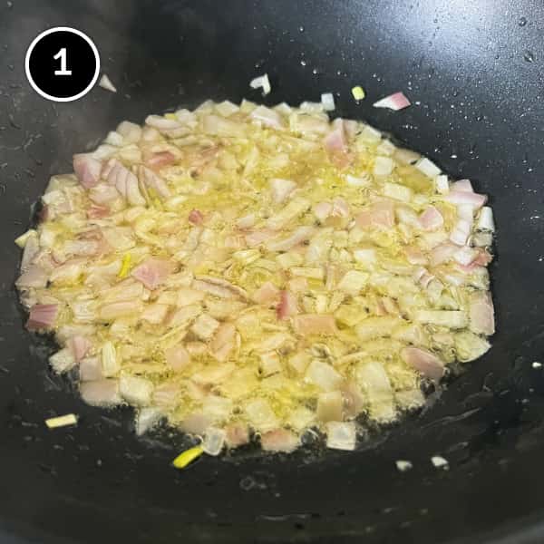 Diced onion sauteing in a pan