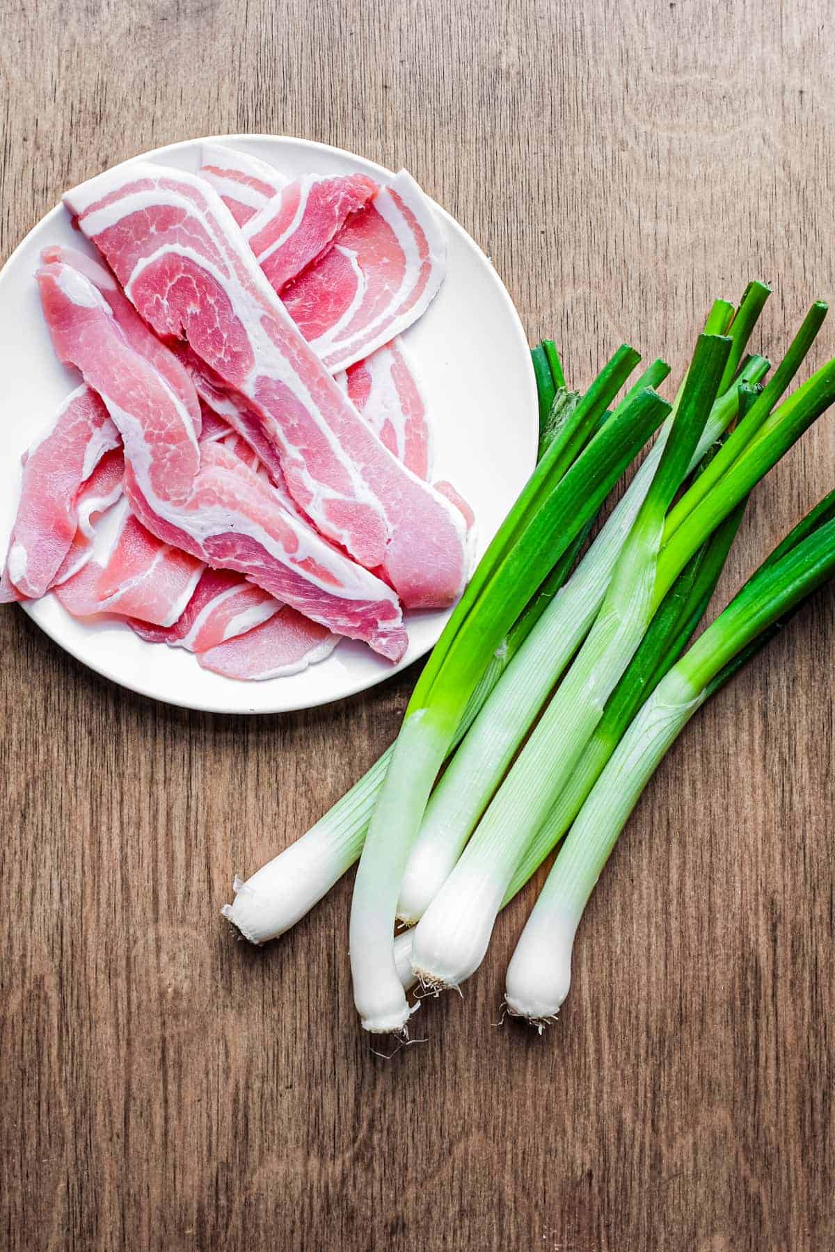 Italian sliced pancetta and spring onions.