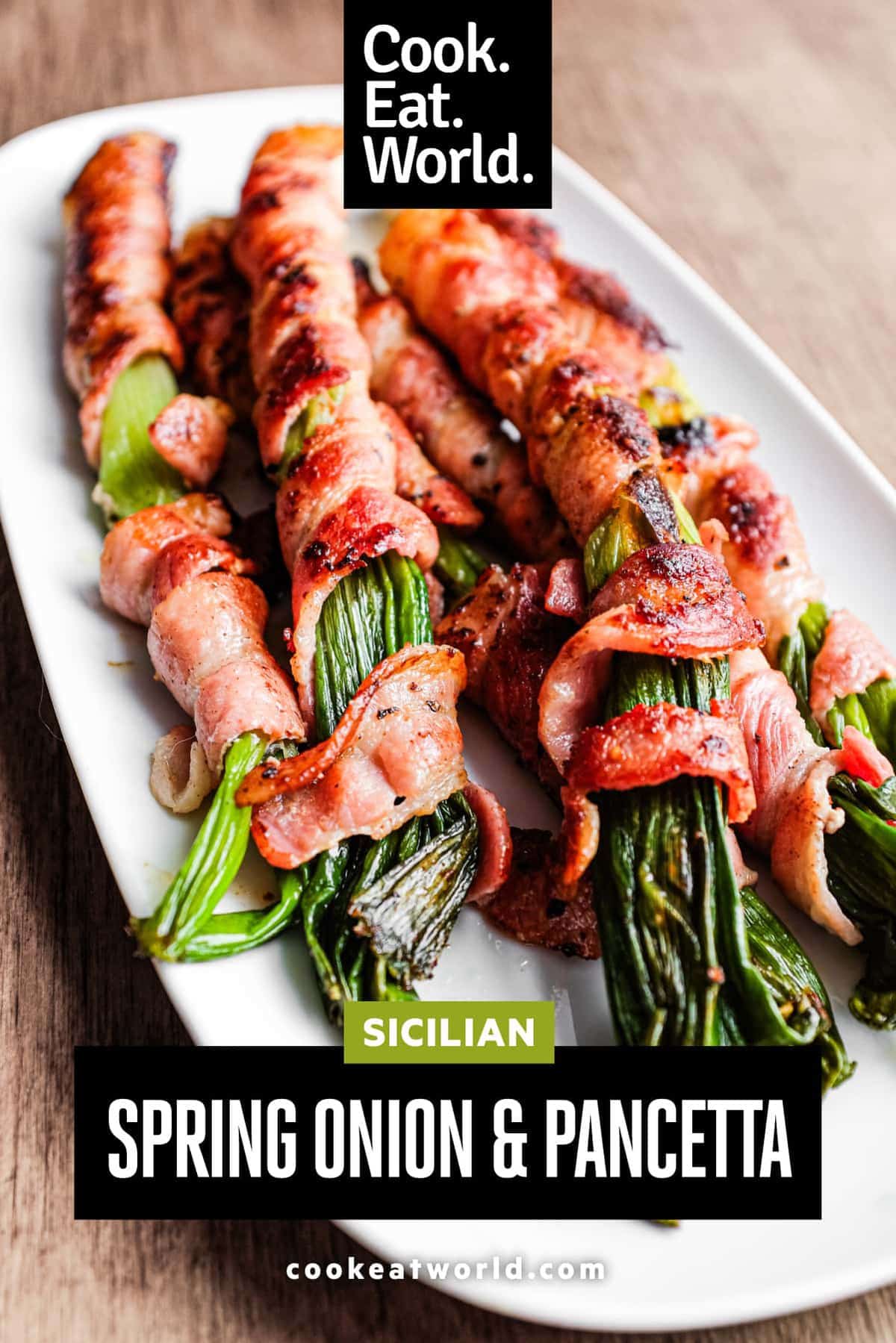 A platter of charred spring onions wrapped in pancetta