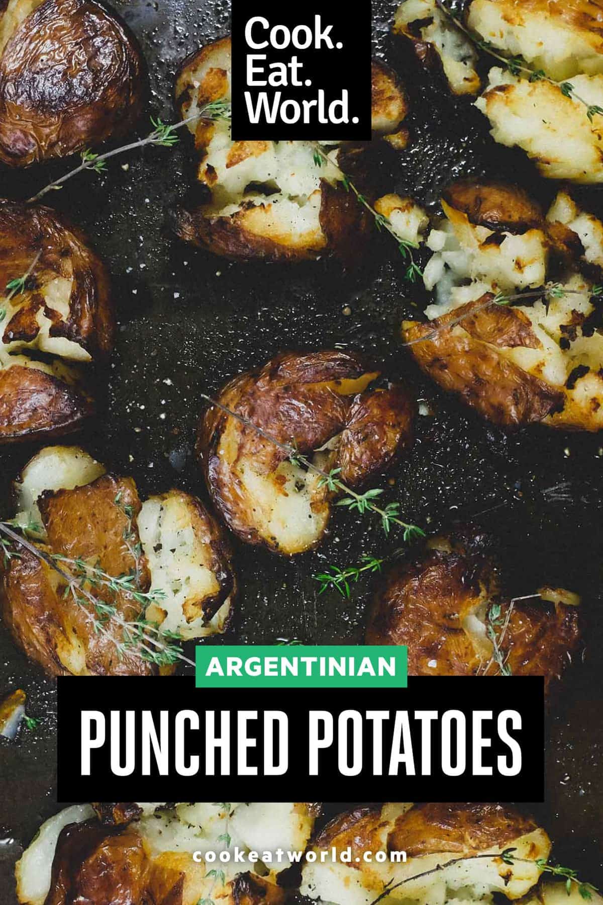 Punched potatoes on a baking sheet garnished with a little fresh thyme.