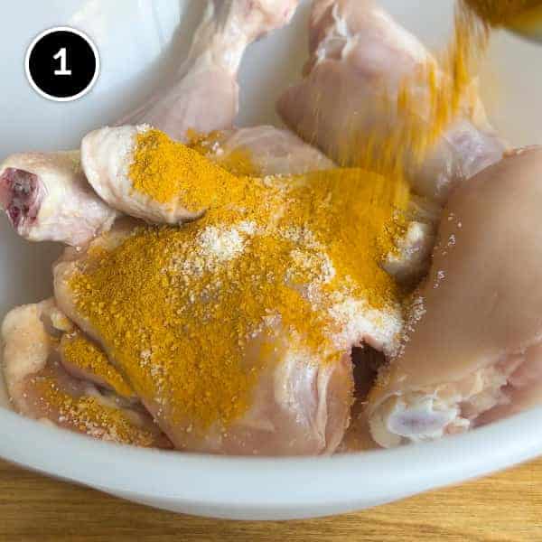 Chicken pieces sprinkled with salt and ground turmeric
