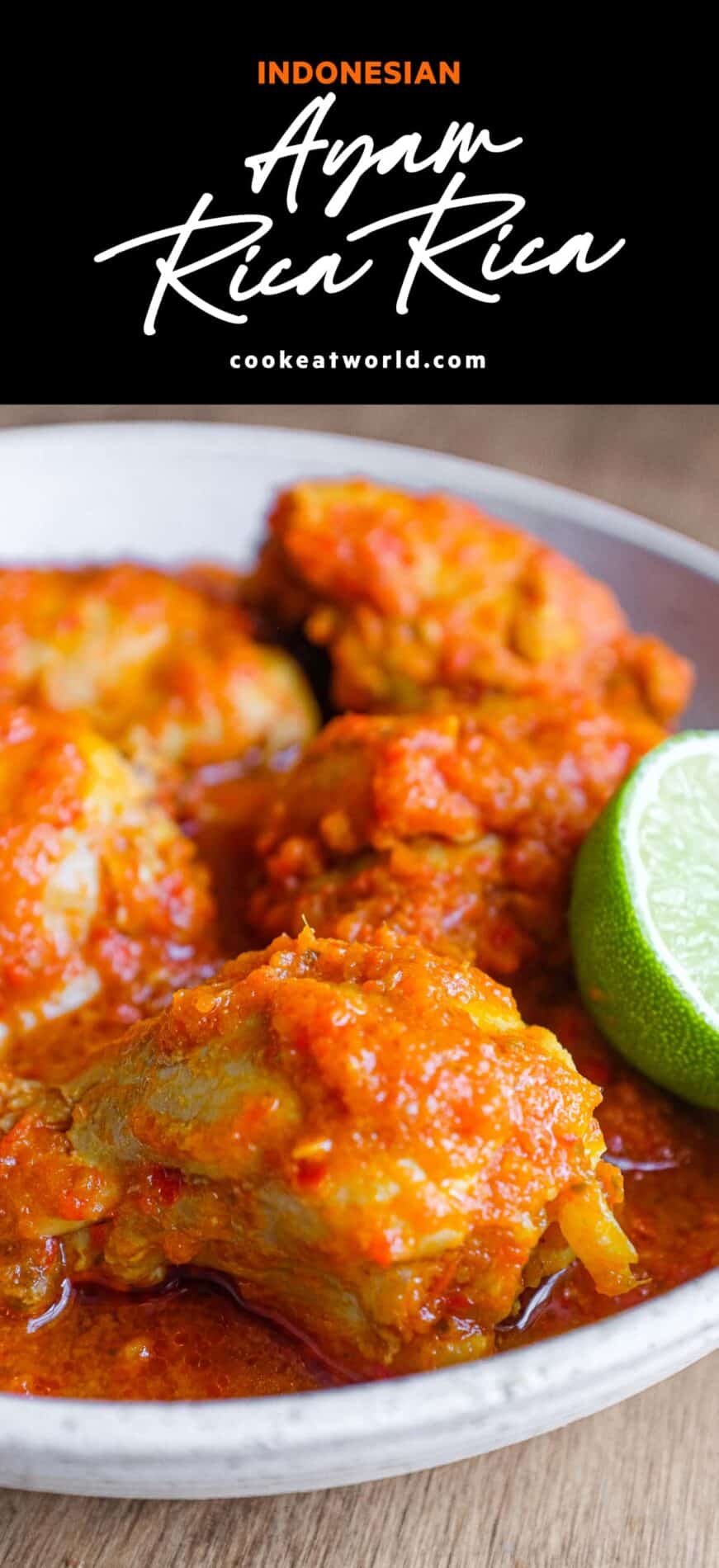 A bowl of Indonesian Ayam Rica Rica. A lime segment sits alongside as a garnish.