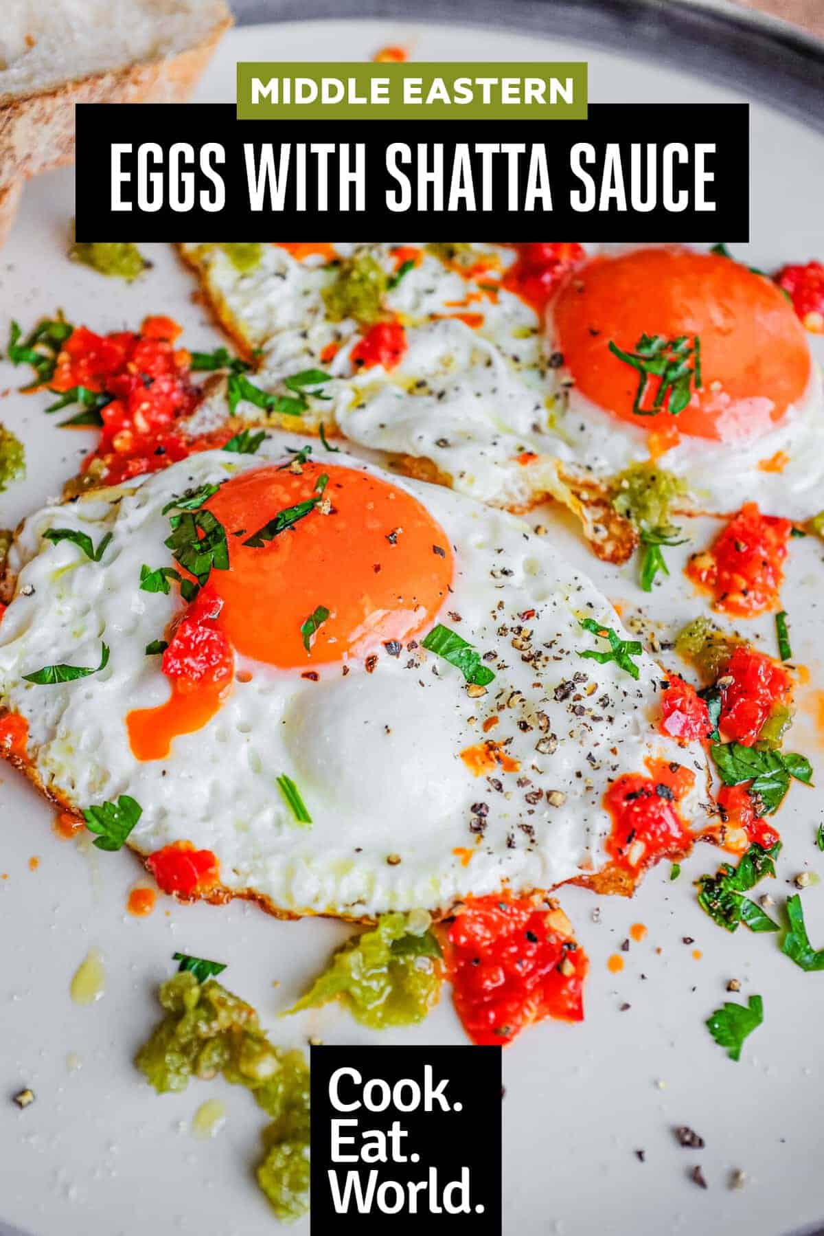 A plate with two fried eggs dotted with spicy Shatta chilli sauce. 