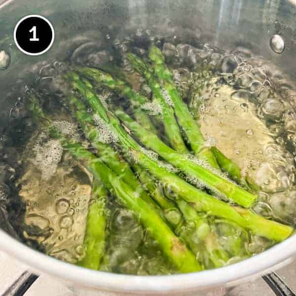 Asparagus boiling in a pan