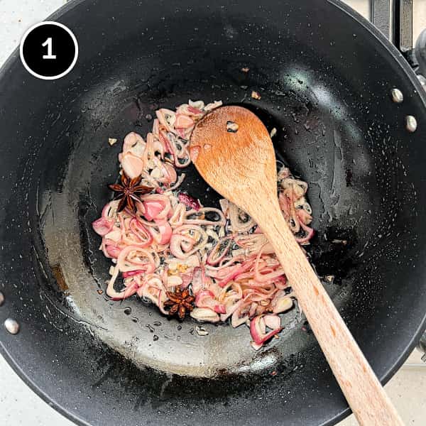 Gaeng Hung Lay (Northern Thai Pork Curry) | cookeatworld.com Frying shallots in a large pan