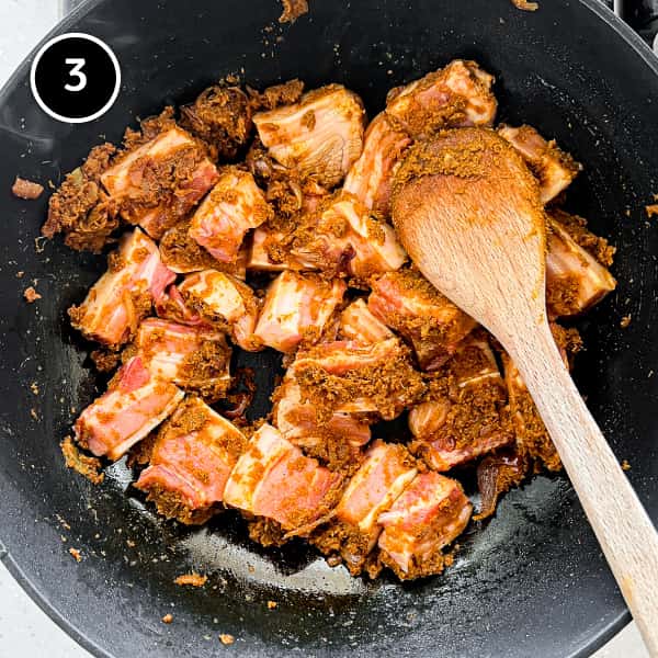 Gaeng Hung Lay (Northern Thai Pork Curry) | cookeatworld.com Frying the pork in a gaeng hung lay curry paste