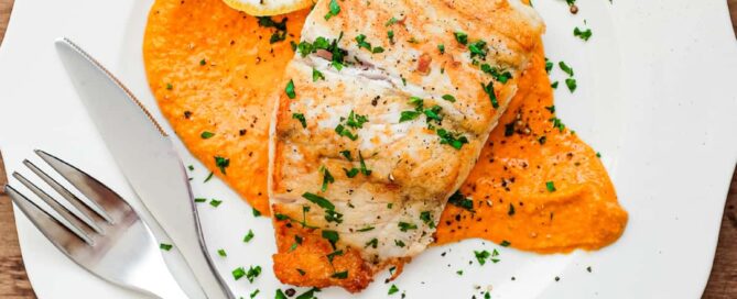 Pan fried fish on a bed of Spanish Romesco Sauce