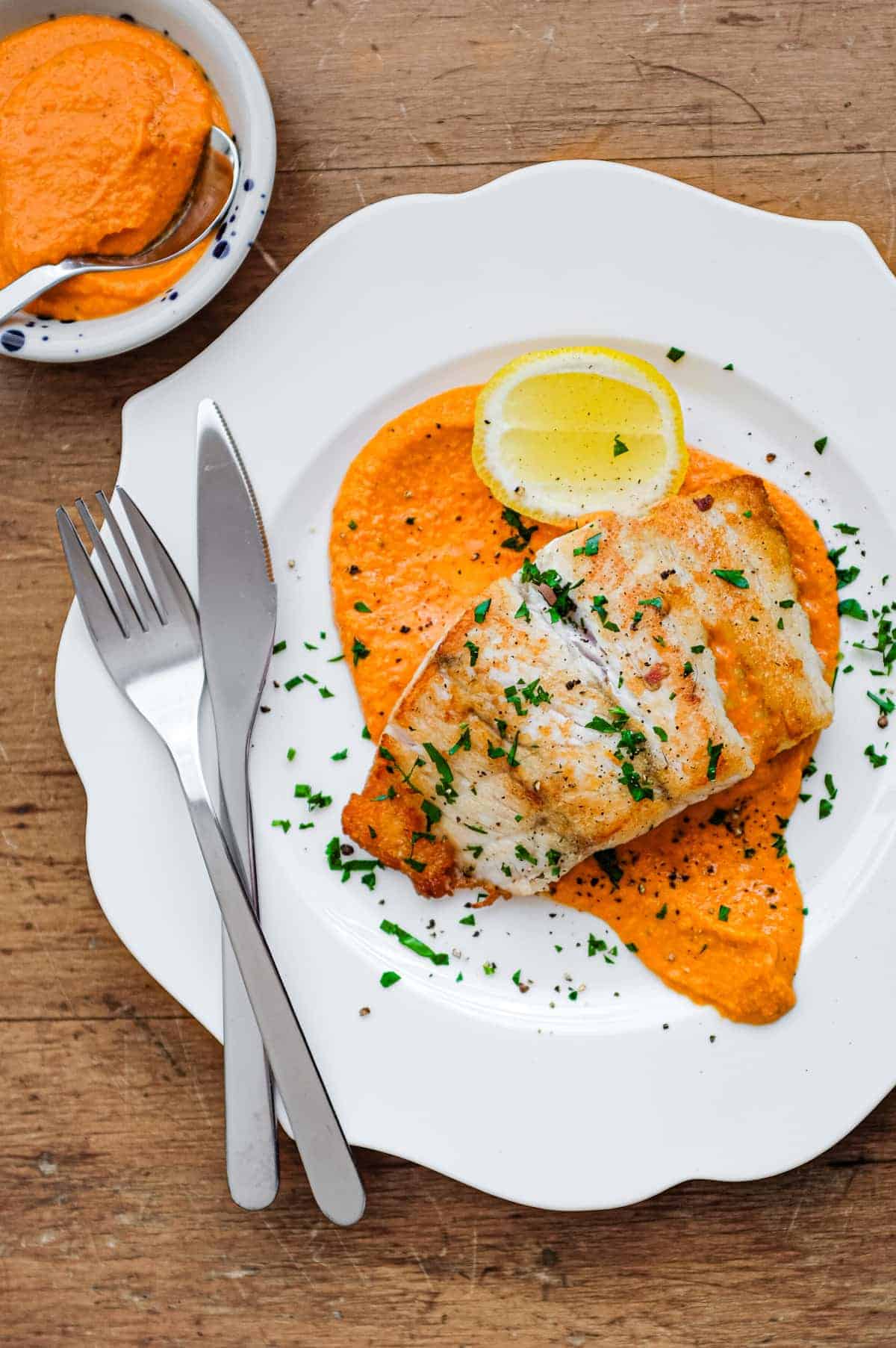 Pan fried fish on a bed of Spanish Romesco Sauce