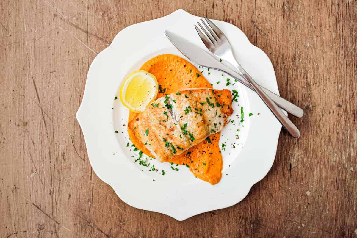 Pan fried fish on a bed of Spanish Romesco Sauce