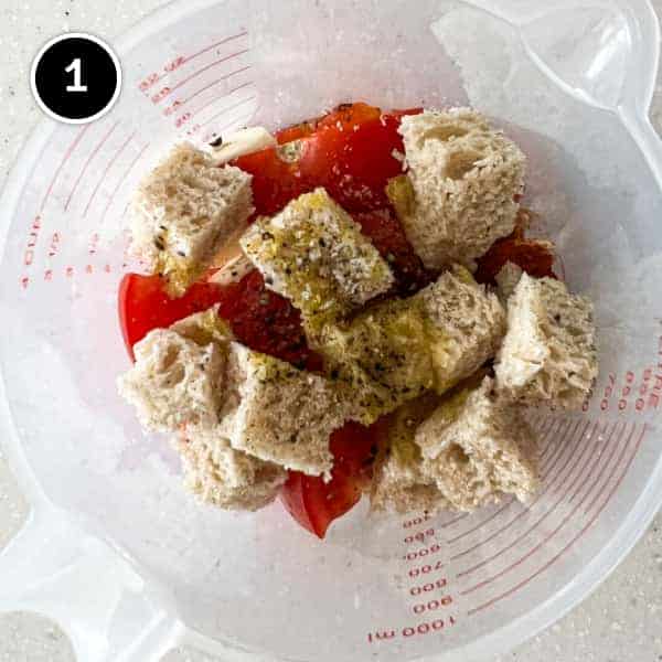 The ingredients before blending for a Spanish Romesco Sauce in a plastic jug.