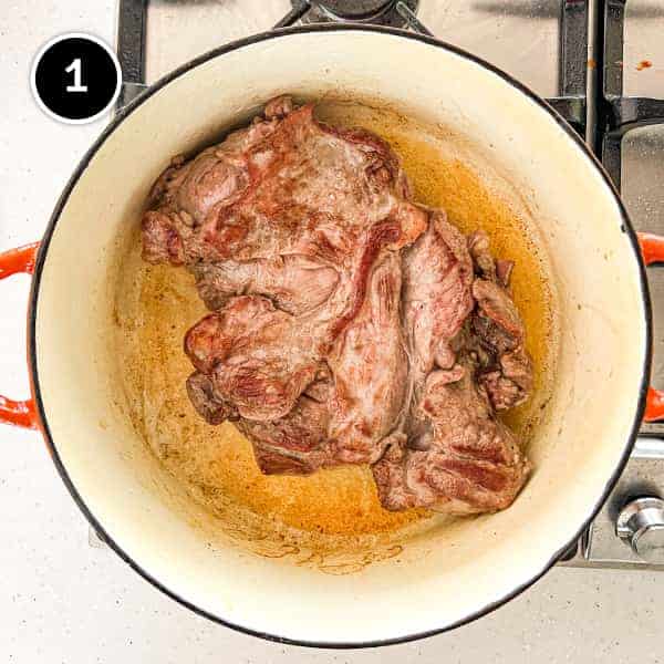 Lamb searing in a pan