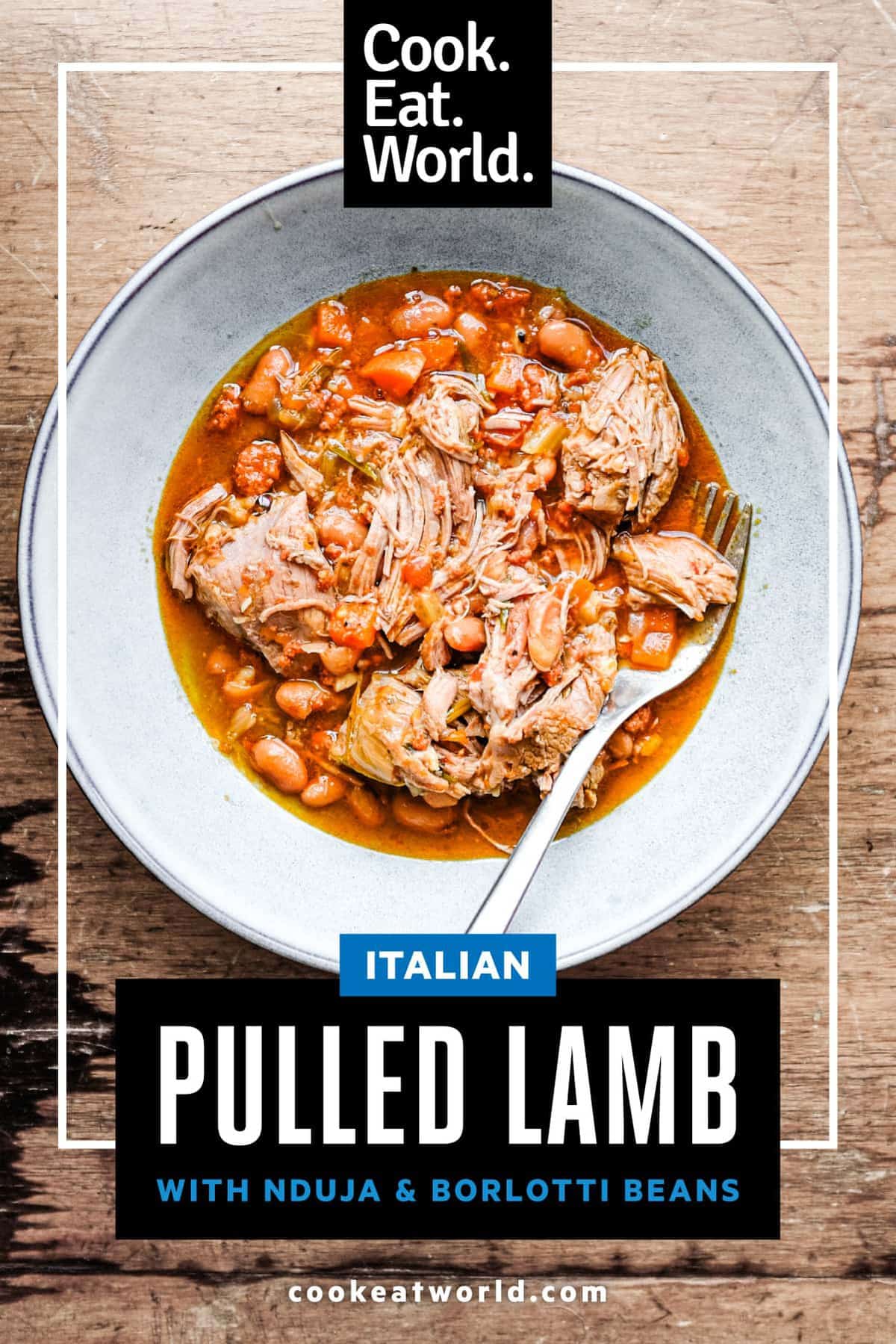 A bowl of Italian pulled lamb with beans with a fork