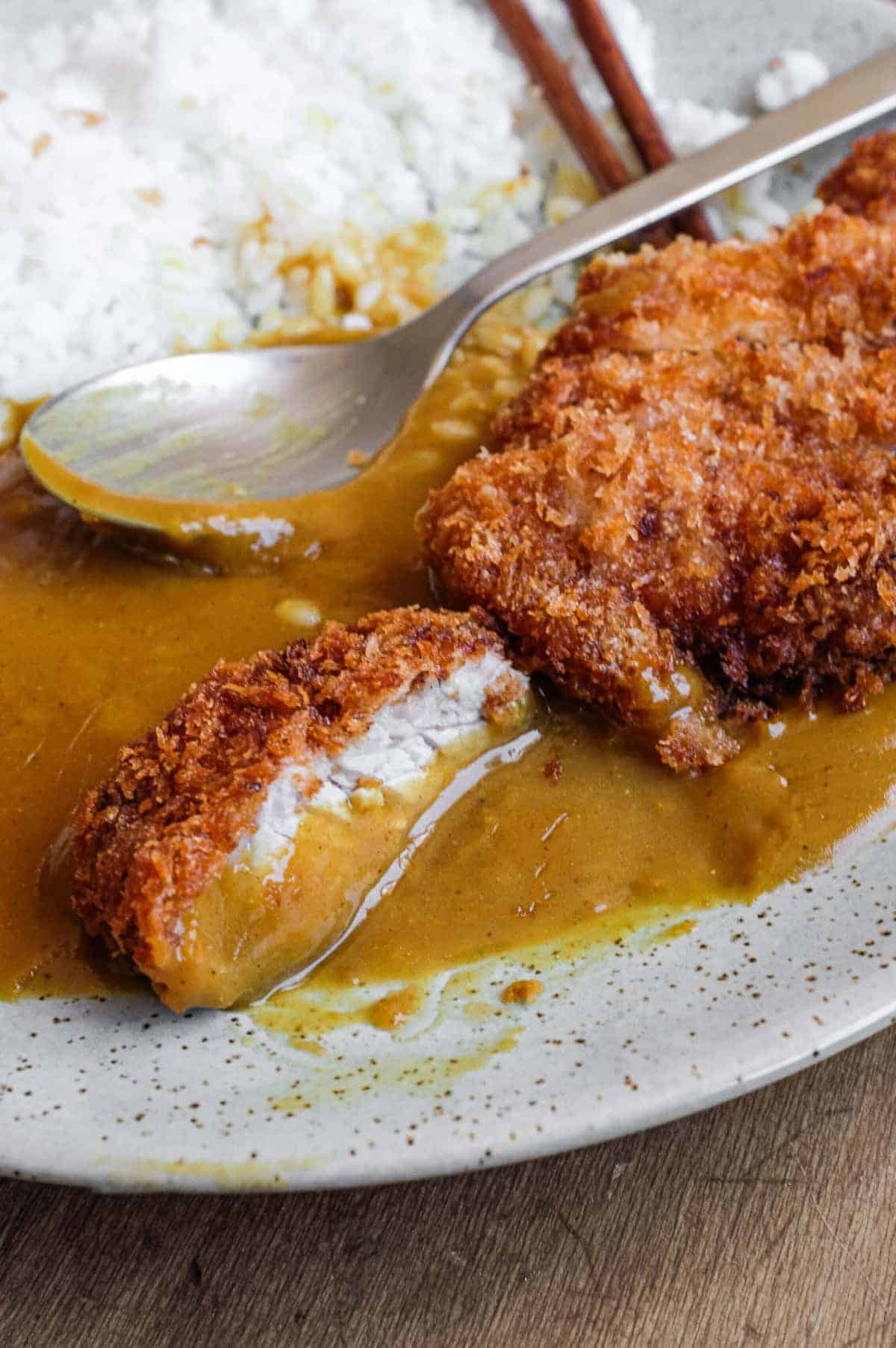 A plate of Japanese pork katsu curry with rice.
