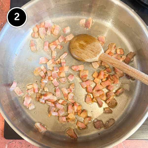 Pasta Alla Zozzona – cookeatworld.com A pan of guanciale pieces frying
