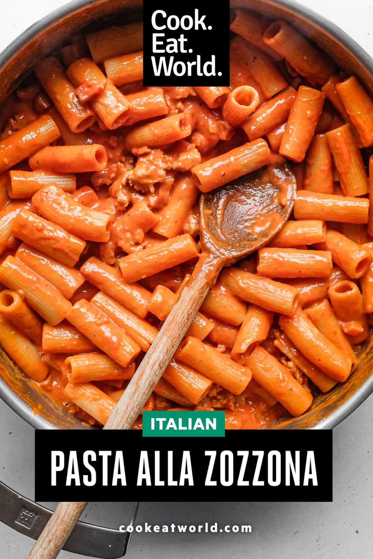 Pasta Alla Zozzona – cookeatworld.com A panof Pasta Alla Zozzona in a rich tomato sauce with a wooden spoon.