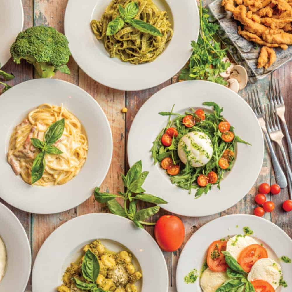 An array of Italian dishes on plates