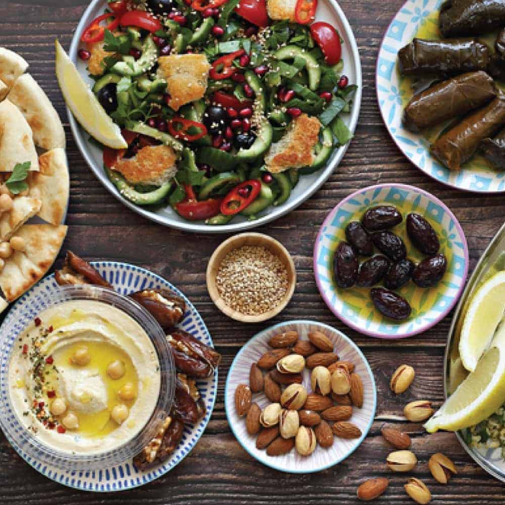 An array of Middle Eastern dishes on plates