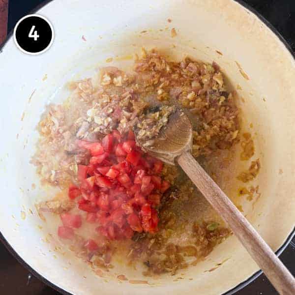 Chicken Rogan Josh | cookeatworld.com Chopped tomatoes are added to an onion mix for a rogan josh curry