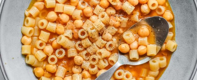 an overhead photograph of a bowl of Italian pasta e ceci (pasta with chickpeas)