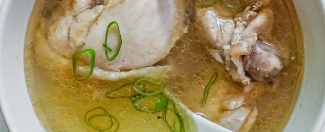 An overhead shot of a bowl of Taiwanese Sesame Oil Chicken Soup