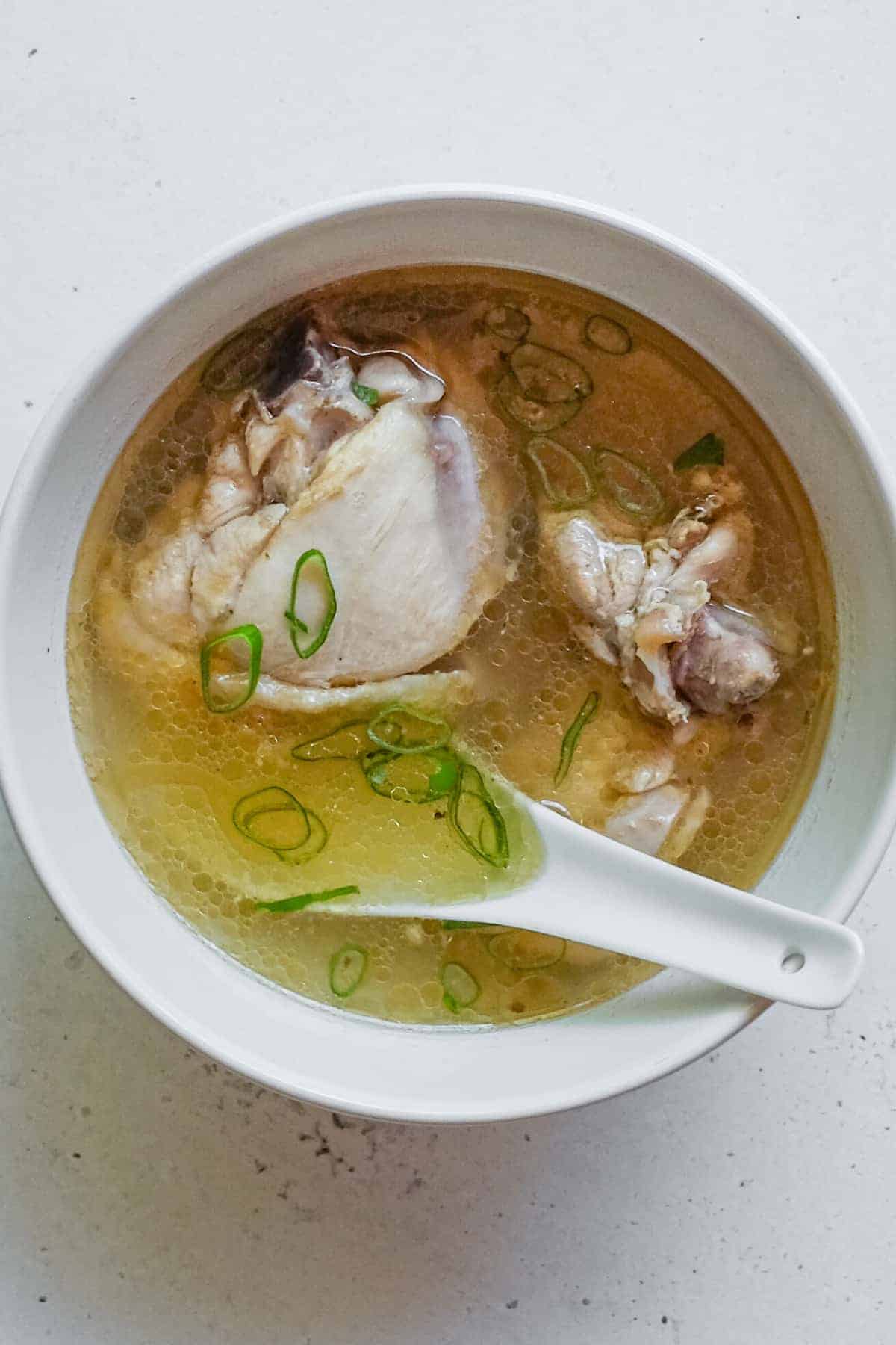 An overhead shot of a bowl of Taiwanese Sesame Oil Chicken Soup