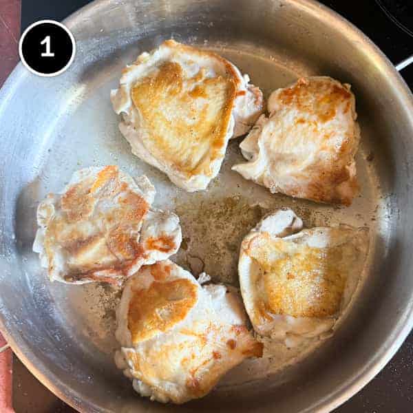 Youvetsi Chicken (Greek Chicken and Orzo Bake) | cookeatworld.com Chicken thights fry and brown in a pan.