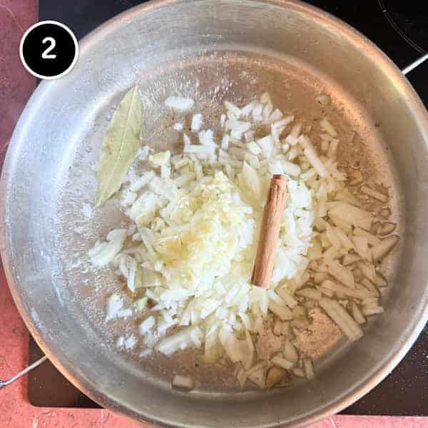 Youvetsi Chicken (Greek Chicken and Orzo Bake) | cookeatworld.com Onions fry in oil with a bay leaf and cinnamon stick.