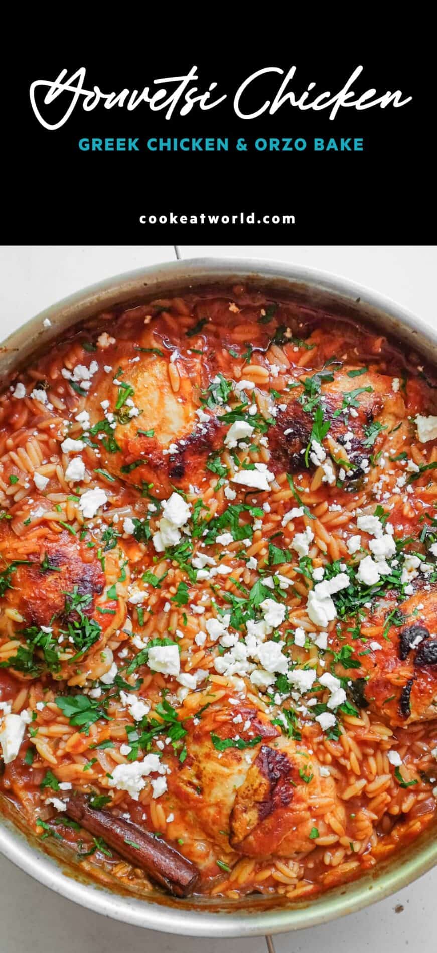 A pan of Greek Youvetsi Chicken rests in a pan, scattered with parsley and feta cheese.
