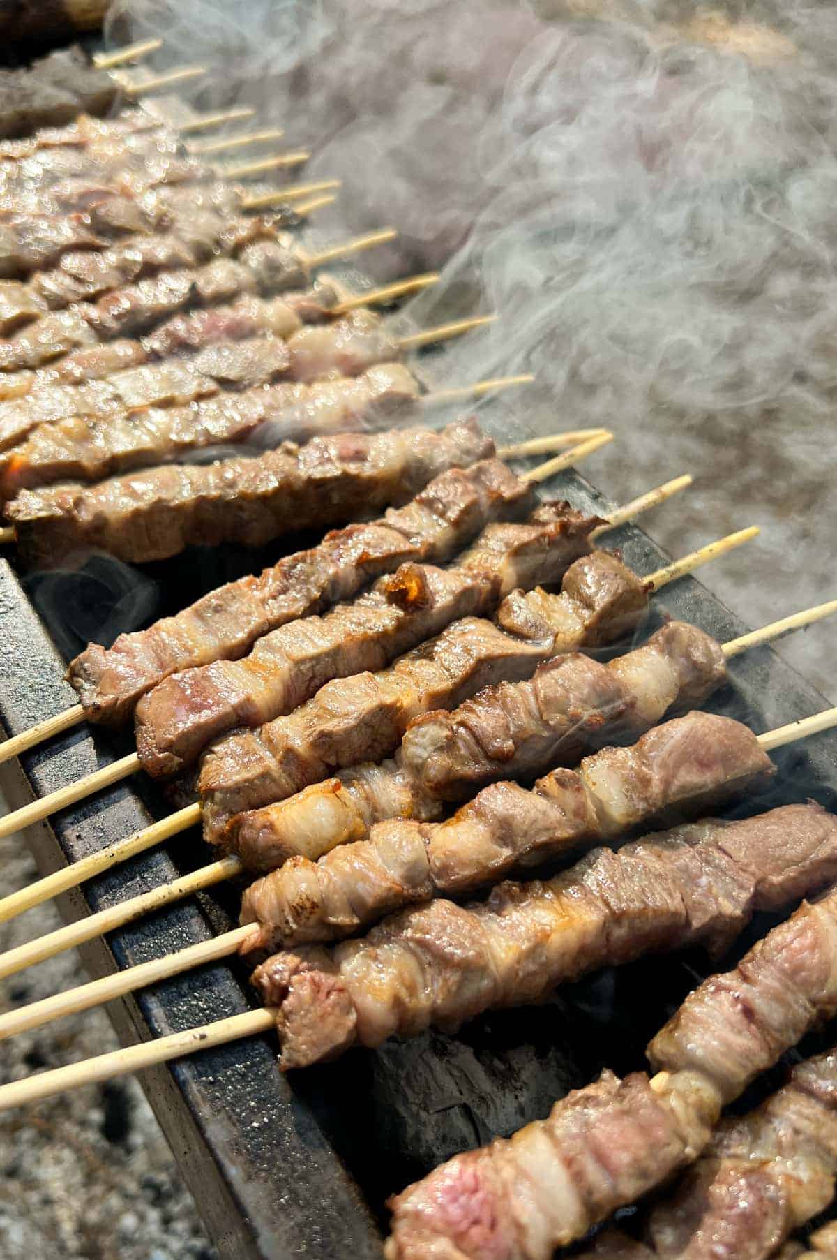 Arrosticini (Italian Lamb Skewers) | cookeatworld.com Traditional Abruzzese arrosticini cooked on a narrow grill