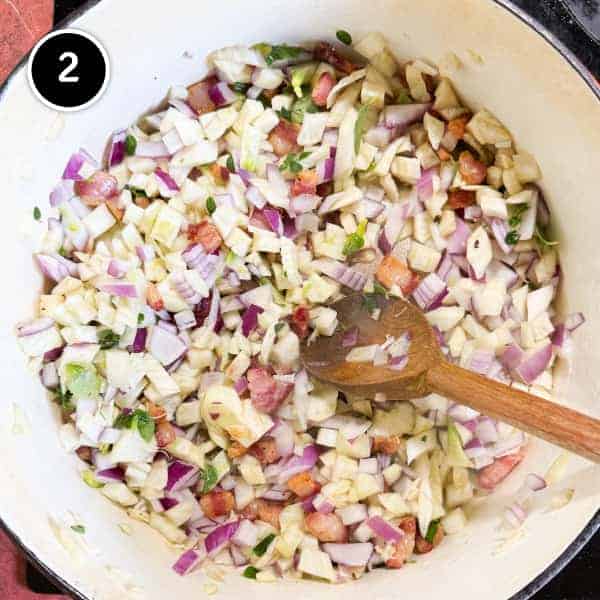 Italian Chicken Thighs with Cannellini Beans and Fennel | cookeatworld.com Onion and fennel fry in oil with pancetta, garlic and herbs in a large Dutch oven