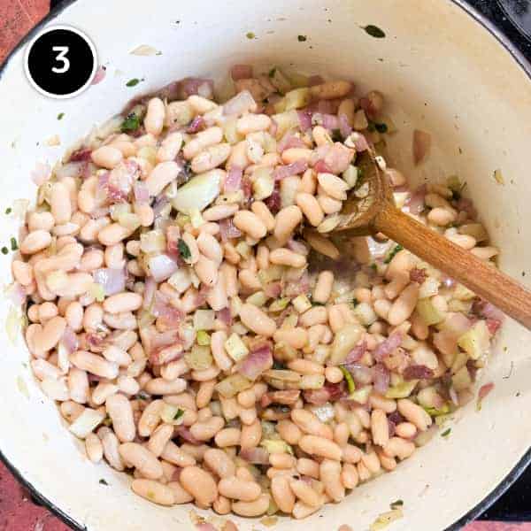 Italian Chicken Thighs with Cannellini Beans and Fennel | cookeatworld.com Beans and stock are added to the sautéed vegetables and pancetta in a large Dutch oven