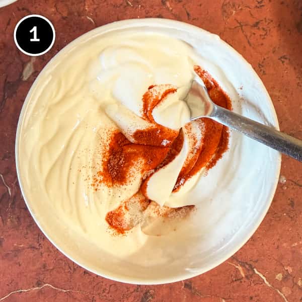 Aloo Chukauni – Nepali Yoghurt-Spiced Potatoes | cookeatworld.com Chilli, salt and lime juice being stirred into fresh yoghurt