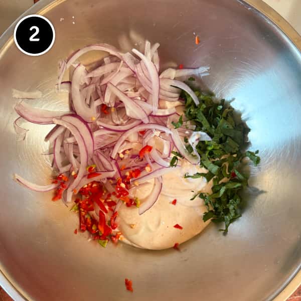 Aloo Chukauni – Nepali Yoghurt-Spiced Potatoes | cookeatworld.com Onion, cilantro and chillies being incorporated into yoghurt