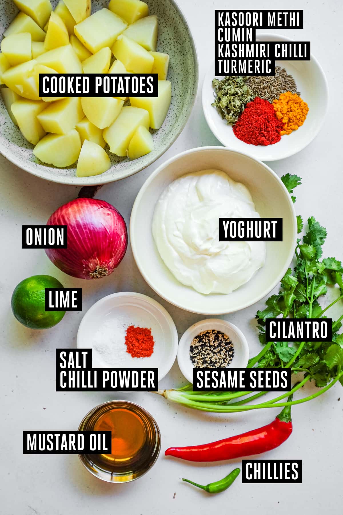 Aloo Chukauni – Nepali Yoghurt-Spiced Potatoes | cookeatworld.com The ingredients for Aloo Chukauni: Potatoes, spices, onion, lime, yoghurt, sesame seeds, cilantro, chillies, and mustard oil
