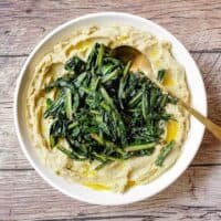 A large platter of fava bean puree (fave e cicoria) with sauteed chicory